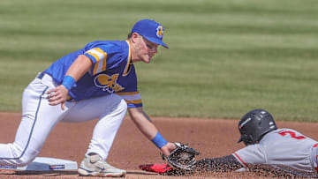 RubberDucks second baseman Travis Bazzana applies the tag to Altoona Curve’s Termarr Johnson, who was called safe with a stolen base, on April 13, 2025, in Akron, Ohio.