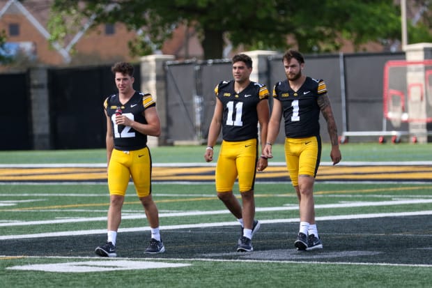 Iowa QBs (L-R) Cade McNamara, Marco Lainez and Brendan Sullivan  at the team's annual media day on Aug. 9, 2024 in Iowa City.