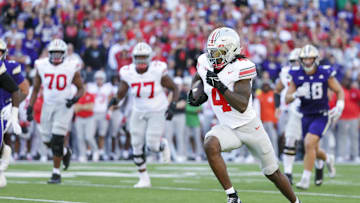 Sep 27, 2025; Seattle, Washington, USA; Ohio State Buckeyes wide receiver Jeremiah Smith (4) runs for a touchdown after catching a pass against the Washington Huskies during the second quarter at Husky Stadium. Mandatory Credit: Joe Nicholson-Imagn Images