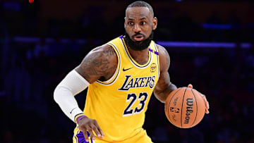 Los Angeles Lakers forward LeBron James (23) controls the ball against the Miami Heat during the second half at Crypto.com Arena.