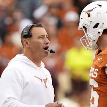 Texas Longhorns head coach Steve Sarkisian talks with quarterback Arch Manning during a timeout in the second half against the Vanderbilt Commodores at Darrell K Royal-Texas Memorial Stadium. 