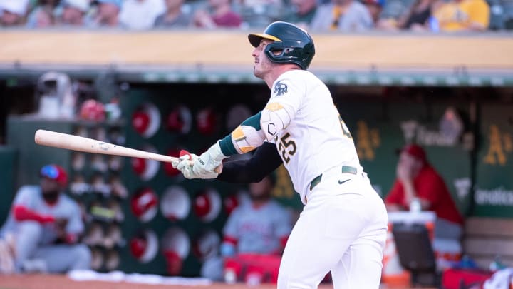 Jul 2, 2024; Oakland, California, USA; Oakland Athletics outfielder Brent Rooker (25) hits a home run against the Los Angeles Angels during the fourth inning at Oakland-Alameda County Coliseum. Mandatory Credit: Ed Szczepanski-USA TODAY Sports