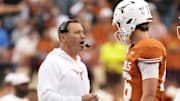 Nov 1, 2025; Austin, Texas, USA; Texas Longhorns head coach Steve Sarkisian talks with quarterback Arch Manning (16) during a timeout in the second half against the Vanderbilt Commodores at Darrell K Royal-Texas Memorial Stadium. Mandatory Credit: Scott Wachter-Imagn Images