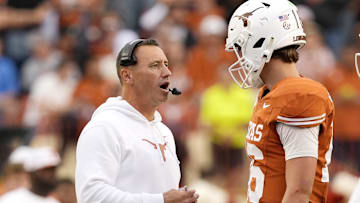 Nov 1, 2025; Austin, Texas, USA; Texas Longhorns head coach Steve Sarkisian talks with quarterback Arch Manning (16) during a timeout in the second half against the Vanderbilt Commodores at Darrell K Royal-Texas Memorial Stadium. Mandatory Credit: Scott Wachter-Imagn Images