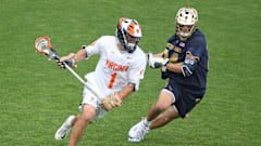 Connor Shellenberger dodges with the ball during the Virginia men's lacrosse game against Notre Dame at Klockner Stadium.