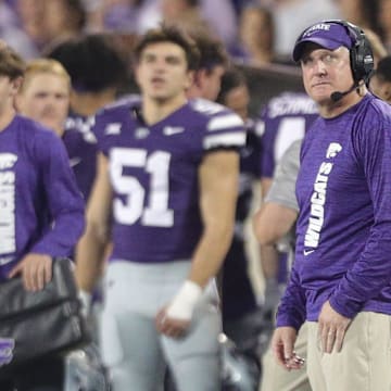 Kansas State Wildcats head coach Chris Klieman looks at the scoreboard during the second quarter of the game against Arizona at Bill Snyder Family Stadium on Friday, September 13, 2024.