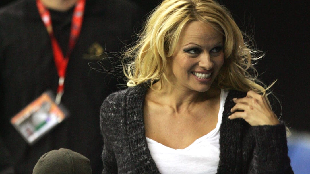 Pamela Anderson with her son at the Canadien Football League 2005 Grey Cup championship at BC Place Stadium. 