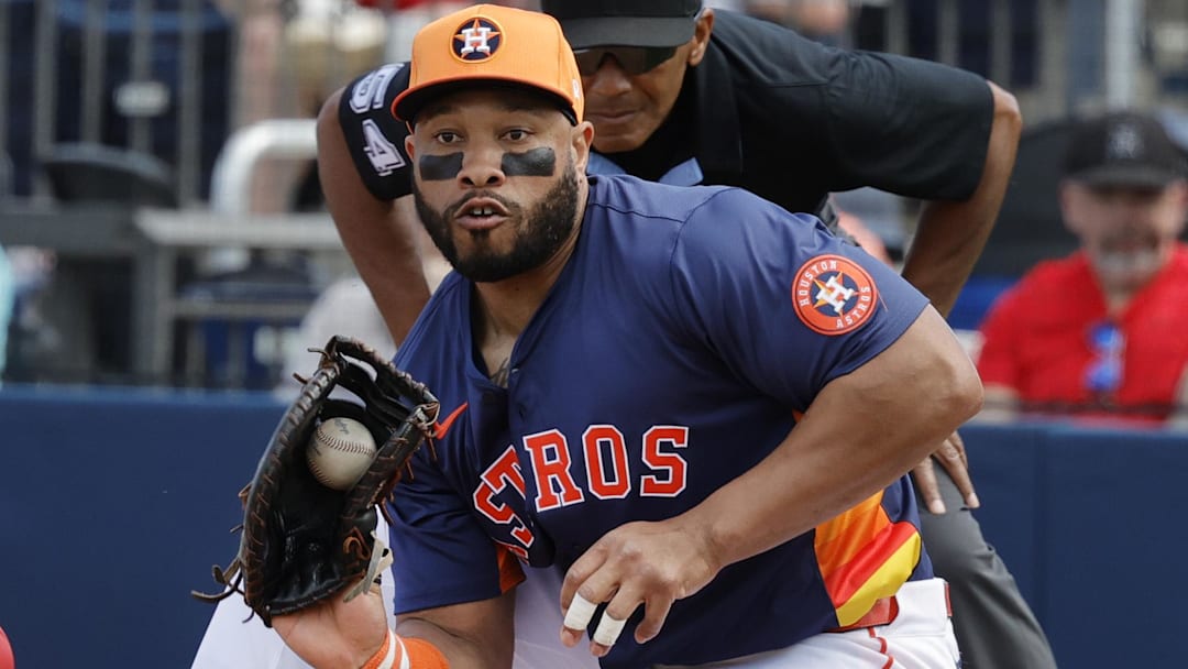 Washington Nationals outfielder Alex Call (17) dives into first base as Houston Astros first base Jon Singleton (28) fields the ball in the second inning at CACTI Park of the Palm Beaches.