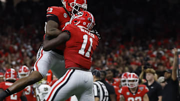 Jan 2, 2025; New Orleans, LA, USA; Georgia Bulldogs linebacker Jalon Walker (11) celebrates with Bulldogs defensive lineman Mykel Williams (13) after making a defensive stop against the Notre Dame Fighting Irish during the first quarter at Caesars Superdome. Mandatory Credit: Geoff Burke-Imagn Images