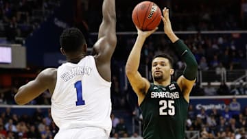 Mar 31, 2019; Washington, DC, USA; Duke Blue Devils forward Zion Williamson (1) prepares to block the shot of Michigan State Spartans forward Kenny Goins (25) in the championship game of the east regional of the 2019 NCAA Tournament at Capital One Arena. Mandatory Credit: Geoff Burke-Imagn Images