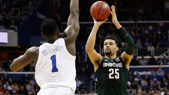 Mar 31, 2019; Washington, DC, USA; Duke Blue Devils forward Zion Williamson (1) prepares to block the shot of Michigan State Spartans forward Kenny Goins (25) in the championship game of the east regional of the 2019 NCAA Tournament at Capital One Arena. Mandatory Credit: Geoff Burke-Imagn Images