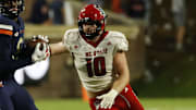 Sep 22, 2023; Charlottesville, Virginia, USA; Virginia Cavaliers wide receiver Malachi Fields (8) catches a pass as North Carolina State Wolfpack linebacker Caden Fordham (10) defends during the fourth quarter at Scott Stadium. Mandatory Credit: Geoff Burke-Imagn Images
