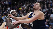 Dec 28, 2024; Denver, Colorado, USA; Detroit Pistons center Isaiah Stewart (28) and Denver Nuggets center Nikola Jokic (15) battle under the basket in the second half at Ball Arena. Mandatory Credit: Ron Chenoy-Imagn Images