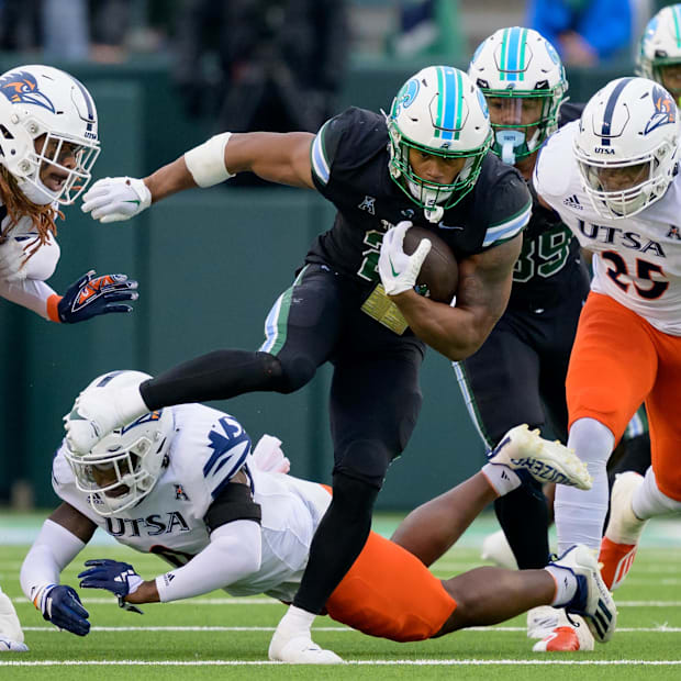 Makhi Hughes (21) runs