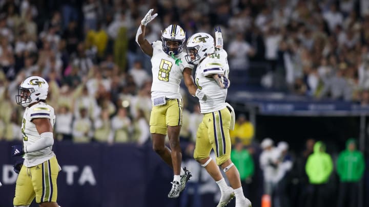 Nov 18, 2023; Atlanta, Georgia, USA; Georgia Tech Yellow Jackets linebacker Kyle Efford (44) celebrates after an interception with wide receiver Malik Rutherford (8) against the Syracuse Orange in the second half at Bobby Dodd Stadium at Hyundai Field. Mandatory Credit: Brett Davis-USA TODAY Sports