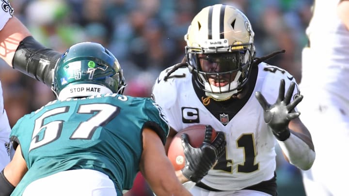 Jan 1, 2023; Philadelphia, Pennsylvania, USA; New Orleans Saints running back Alvin Kamara (41) carries the ball against Philadelphia Eagles linebacker T.J. Edwards (57) during the second quarter at Lincoln Financial Field. Mandatory Credit: Eric Hartline-Imagn Images