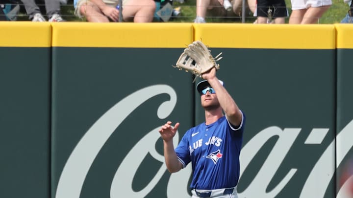 Mar 1, 2025; North Port, Florida, USA; Toronto Blue Jays outfielder RJ Schreck (89) catches a fly ball during the sixth inning against the Atlanta Braves at CoolToday Park. Mandatory Credit: Kim Klement Neitzel-Imagn Images
