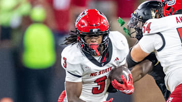 Sep 11, 2025; Winston-Salem, North Carolina, USA;  North Carolina State Wolfpack running back Hollywood Smothers (3) runs the ball in the first half against the Wake Forest Demon Deacons at Allegacy Federal Credit Union Stadium. Mandatory Credit: Luke Jamroz-Imagn Images