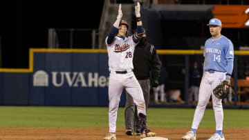 Jacob Ference reacts after hitting a double during the Virginia baseball game against North Carolina at Disharoon Park.