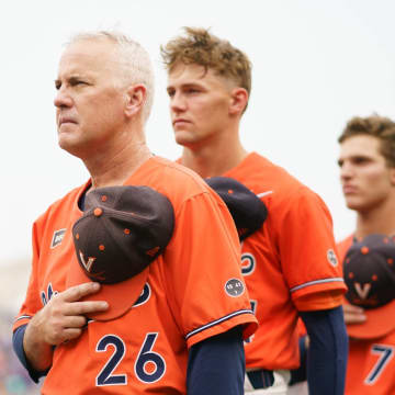 Brian O'Connor stands during the national anthem ahead of the Virginia baseball game vs. Florida at the 2023 College World Series.