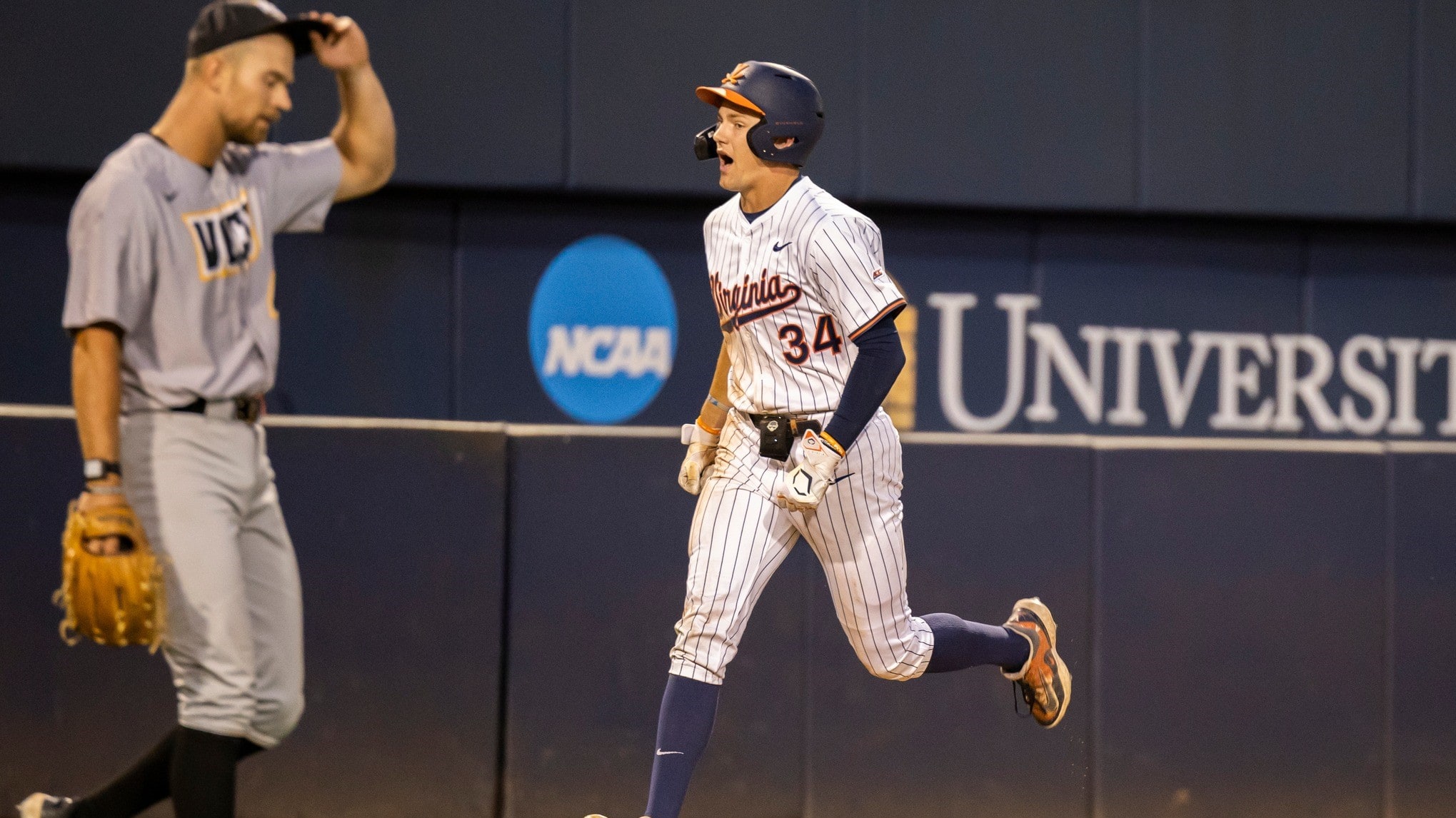 Harrison Didawick rounds the bases after hitting a home run during the Virginia baseball game against VCU at Disharoon Park.