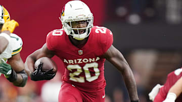Arizona Cardinals running back Bam Knight (20) runs the ball against the Green Bay Packers at State Farm Stadium in Glendale on Oct. 19, 2025.
