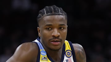 Mar 21, 2025; Cleveland, OH, USA; Marquette Golden Eagles guard Kam Jones (1) dribbles in the first half against the New Mexico Lobos during the NCAA Tournament First Round at Rocket Arena. Mandatory Credit: Rick Osentoski-Imagn Images