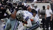 Chicago Bears defensive end Montez Sweat (98) sacks Dallas Cowboys quarterback Dak Prescott (4) during the second half at Soldier Field.