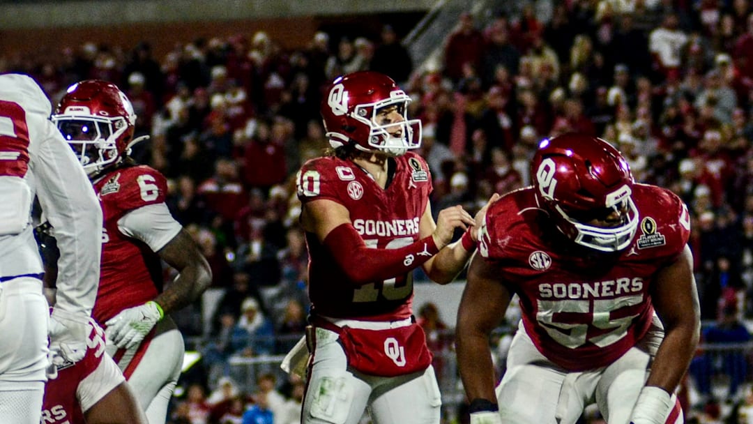 Oklahoma quarterback John Mateer signals to his offense against Alabama in the CFP.