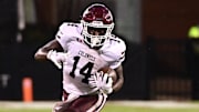 Aug 31, 2024; Starkville, Mississippi, USA; Eastern Kentucky Colonels running back Brayden Latham (14) runs the ball while defended by Mississippi State Bulldogs linebacker JP Purvis (26) during the third quarter at Davis Wade Stadium at Scott Field. Mandatory Credit: Matt Bush-Imagn Images