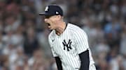 Oct 7, 2025; Bronx, New York, USA; New York Yankees relief pitcher Tim Hill (41) reacts after the last out in the fifth inning against the Toronto Blue Jays during game three of the ALDS round for the 2025 MLB playoffs at Yankee Stadium. Mandatory Credit: Wendell Cruz-Imagn Images