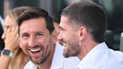 Lionel Messi (left) welcomes Rodrigo De Paul to Inter Miami amid his suspension from MLS play. 