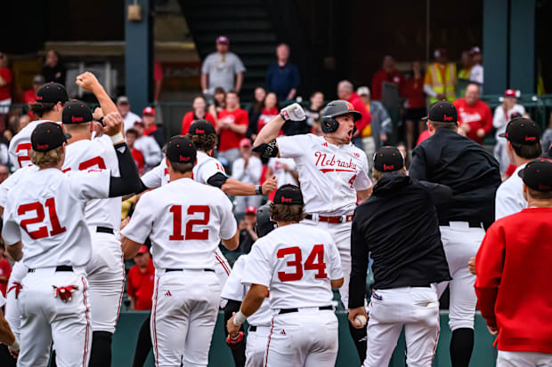 The Husker dugout celebrates Joshua Overbeek's solo home run in the seventh inning. 