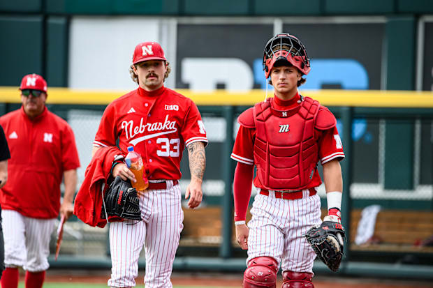 Starting pitcher, Jackson Brockett, and starting catcher, Hogan Helligso, walk out from the bullpen. 