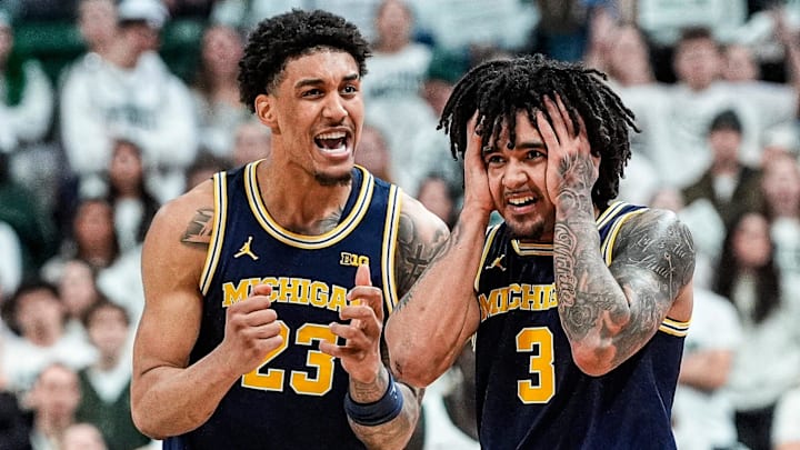 Michigan guard Elliot Cadeau (3) and forward Yaxel Lendeborg (23) 