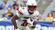 Sep 27, 2025; Pittsburgh, Pennsylvania, USA;  Louisville Cardinals running back Duke Watson (26) runs the ball against the Pittsburgh Panthers during the fourth quarter at Acrisure Stadium. Mandatory Credit: Charles LeClaire-Imagn Images