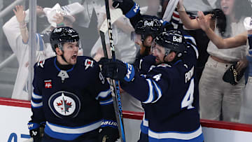May 4, 2025; Winnipeg, Manitoba, CAN; Winnipeg Jets center Cole Perfetti (91) celebrates his goal against the St. Louis Blues with team mates in the third period in game seven of the first round of the 2025 Stanley Cup Playoffs at Canada Life Centre. Mandatory Credit: James Carey Lauder-Imagn Images
