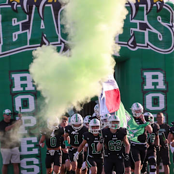 Ropes runs out to the field before a non-district football game, Friday, August 29, 2025, at Eagle Stadium in Ropesville.