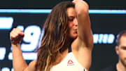Mar 4, 2016; Las Vegas, NV, USA; Miesha Tate flexes and kisses her bicep during weigh-ins for UFC 196 at MGM Grand Garden Arena. Mandatory Credit: Mark J. Rebilas-Imagn Images