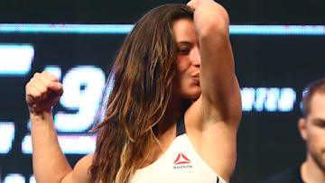 Mar 4, 2016; Las Vegas, NV, USA; Miesha Tate flexes and kisses her bicep during weigh-ins for UFC 196 at MGM Grand Garden Arena. Mandatory Credit: Mark J. Rebilas-Imagn Images