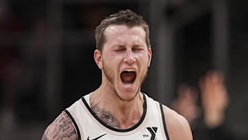 Jan 14, 2025; Atlanta, Georgia, USA; Atlanta Hawks guard Garrison Mathews (24) reacts after making a three point shot against the Phoenix Suns during the second half at State Farm Arena. Mandatory Credit: Dale Zanine-Imagn Images
