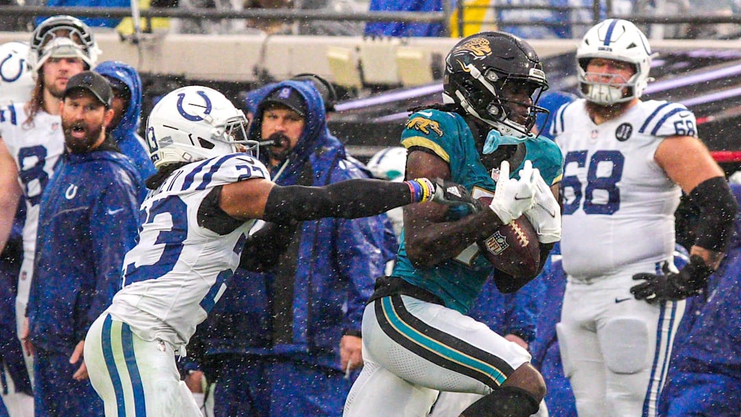 Jacksonville Jaguars wide receiver Brian Thomas Jr. (7) hauls in a pass as Indianapolis Colts cornerback Kenny Moore II (23) pressures him in the third quarter during an NFL football game at EverBank Stadium, Sunday, Dec. 7, 2025, in Jacksonville, Fla. Jaguars won 36-19. [Doug Engle/Florida Times-Union]