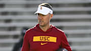 Oct 19, 2024; College Park, Maryland, USA;  Southern California Trojans head coach Lincoln Riley stands on the field before the game against the Maryland Terrapins at SECU Stadium. Mandatory Credit: Tommy Gilligan-Imagn Images