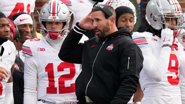 Nov 25, 2023; Ann Arbor, Michigan, USA; Ohio State Buckeyes offensive coordinator Brian Hartline talks on the sideline during the NCAA football game against the Michigan Wolverines at Michigan Stadium. Ohio State lost 30-24.