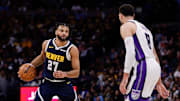 Nov 3, 2025; Denver, Colorado, USA; Denver Nuggets guard Jamal Murray (27) controls the ball as Sacramento Kings guard Zach LaVine (8) guards in the second quarter at Ball Arena. Mandatory Credit: Isaiah J. Downing-Imagn Images