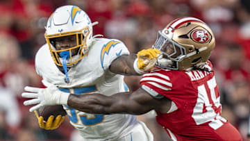 August 23, 2025; Santa Clara, California, USA; Los Angeles Chargers running back Raheim Sanders (35) runs the football against San Francisco 49ers linebacker Nick Martin (45) during the third quarter at Levi's Stadium. Mandatory Credit: Kyle Terada-Imagn Images