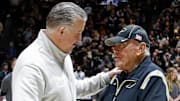 Purdue Boilermakers head coach Matt Painter and Gene Keady shake hands 