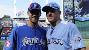 July 9, 2012; Kansas City, MO, USA; American League outfielder Mike Trout (right) of the Los Angeles Angels poses for a photo with National League outfielder Bryce Harper (left) of the Washington Nationals during practice for the 2012 All Star Game at Kauffman Stadium.  