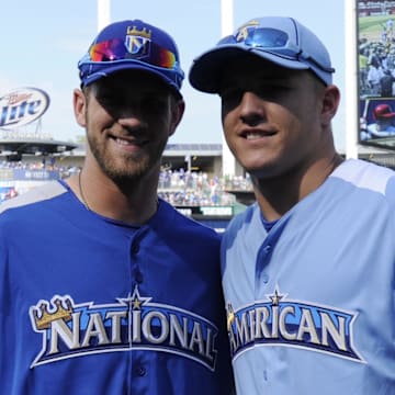 July 9, 2012; Kansas City, MO, USA; American League outfielder Mike Trout (right) of the Los Angeles Angels poses for a photo with National League outfielder Bryce Harper (left) of the Washington Nationals during practice for the 2012 All Star Game at Kauffman Stadium.  