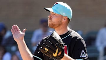 Arizona Diamondbacks pitcher Corbin Burnes reacts after winning the first ABS challenge against the Colorado Rockies in his debut on opening day of spring training season at Salt River Fields at Talking Stick in Scottsdale on Feb. 21, 2025.